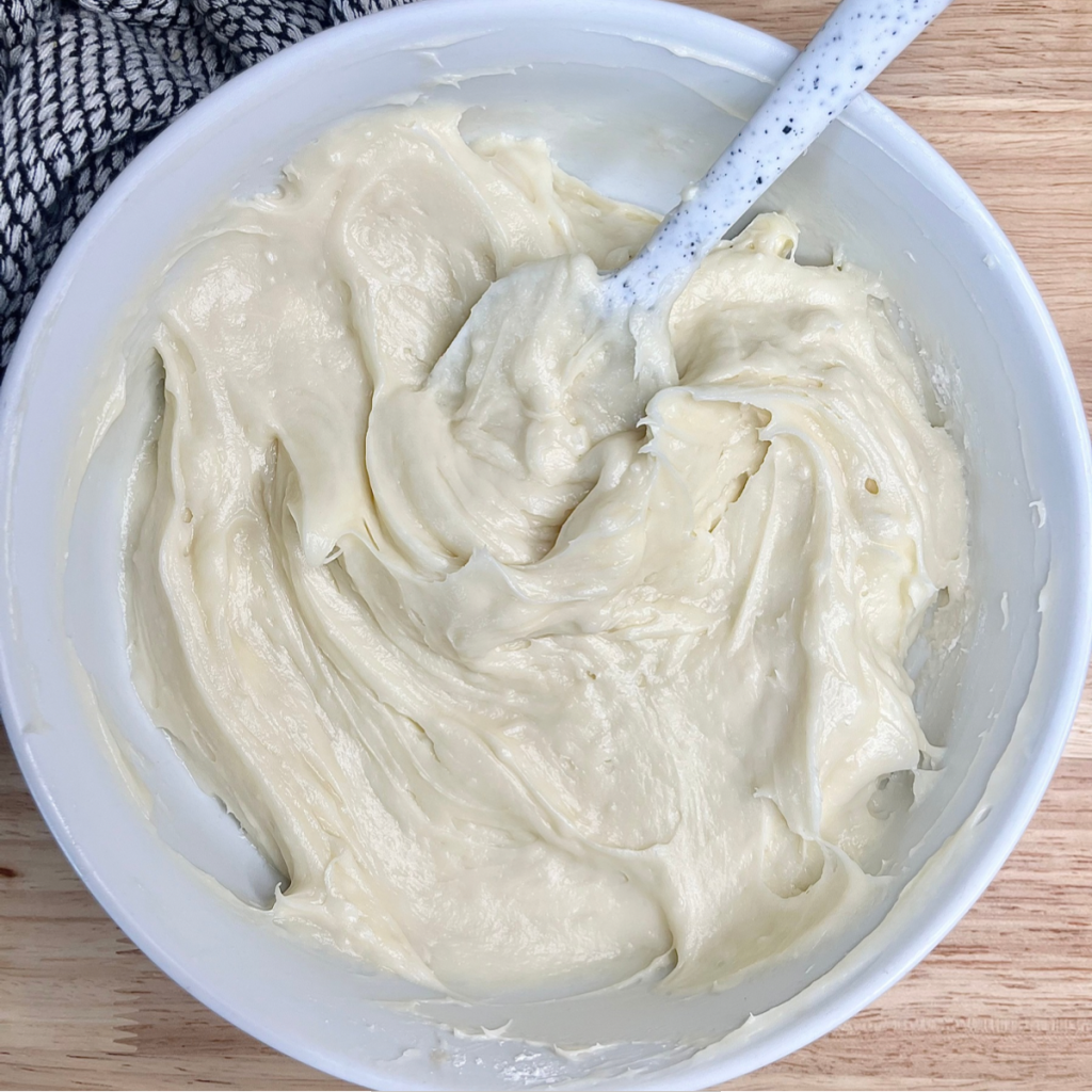 Fruit Pizza sweetened cream cheese base in a white bowl 