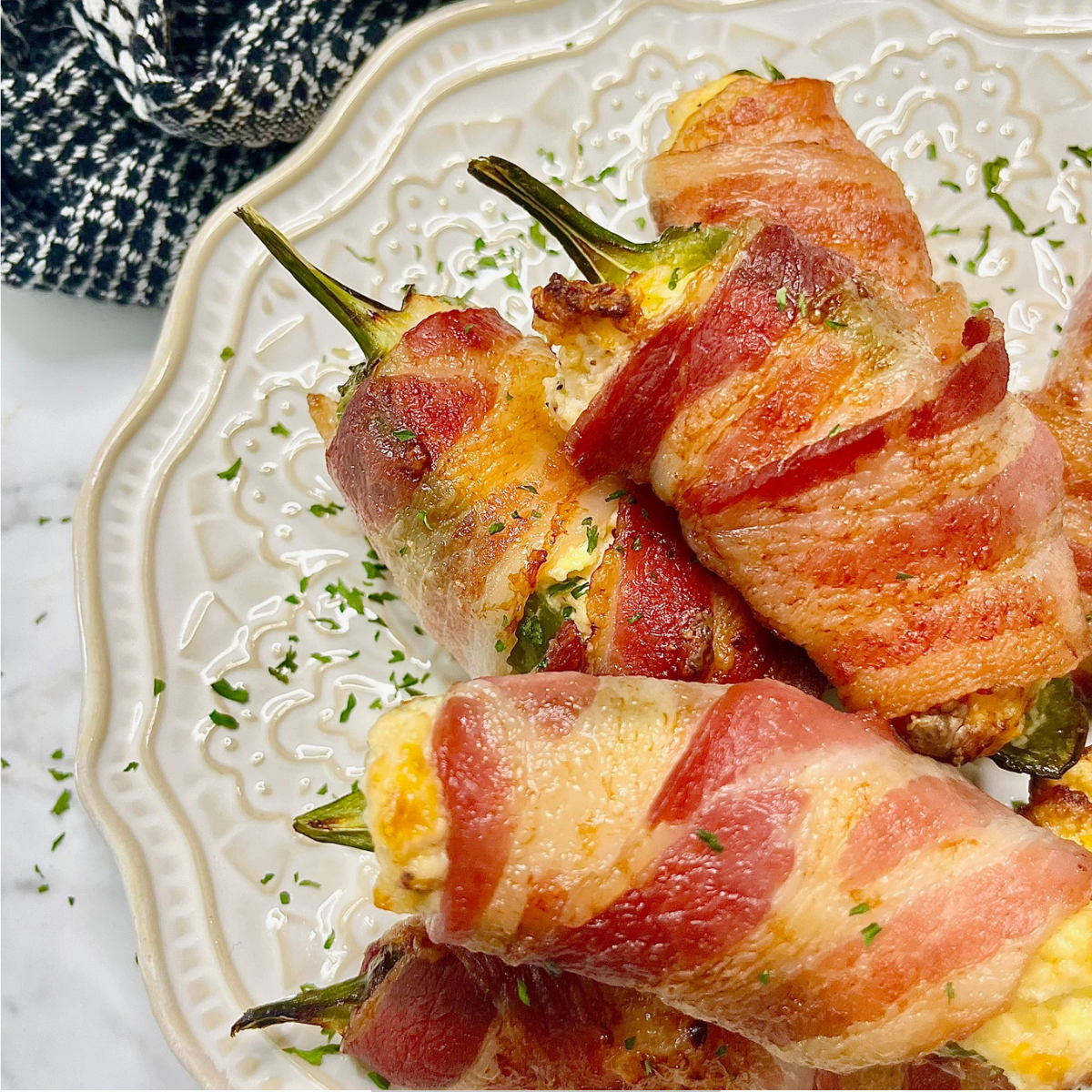 Air Fryer Breakfast Jalapeno Poppers stacked on a plate