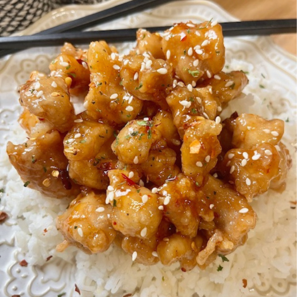 Close up image of Crispy Sweet Chili Chicken on a bed of white rice