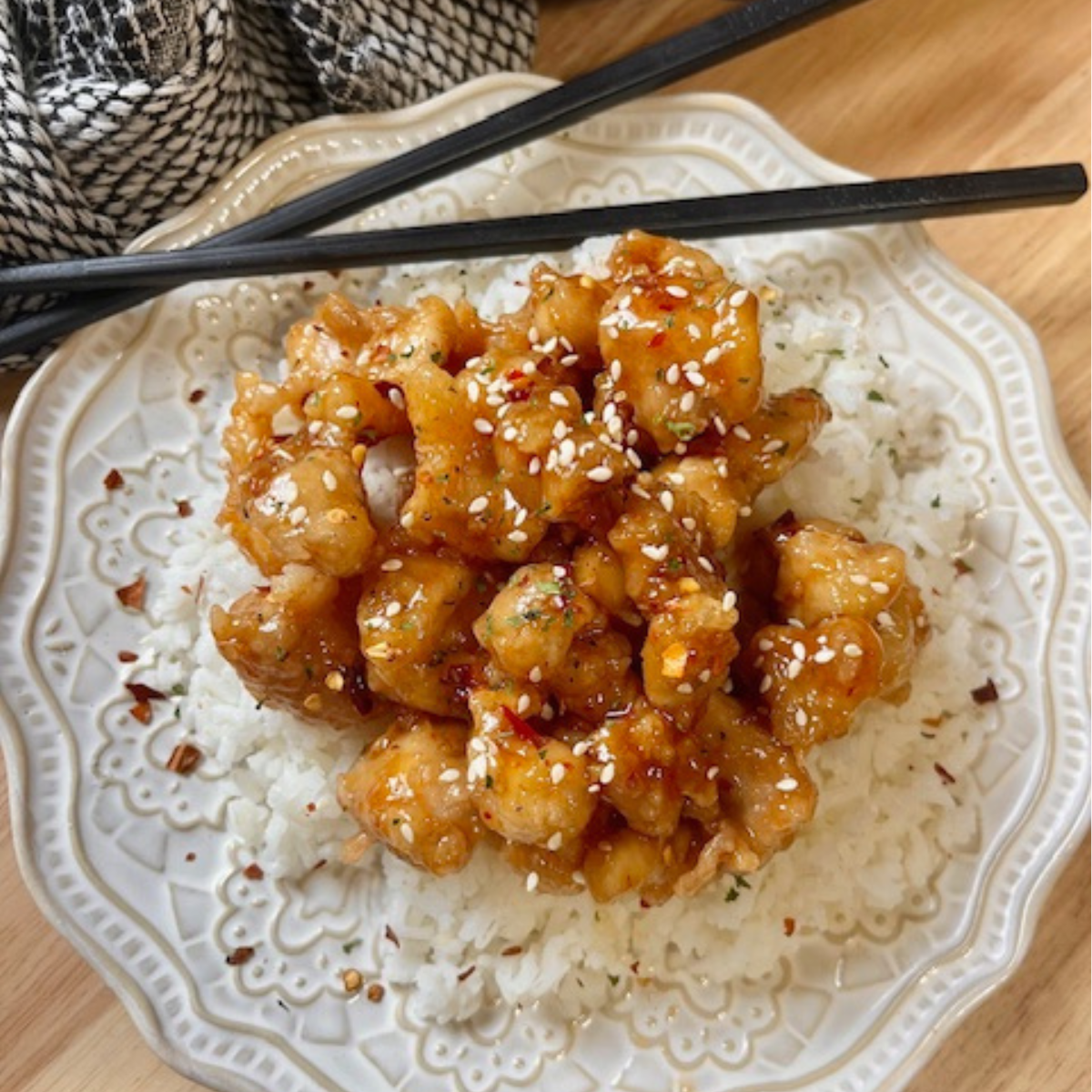 Overhead image of Sweet Chili Chicken on a white plate with rice