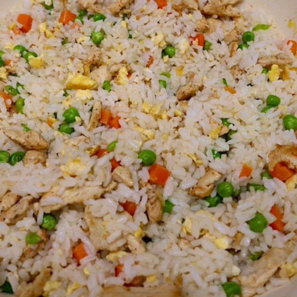 Close up image of Chicken fried rice in a skillet