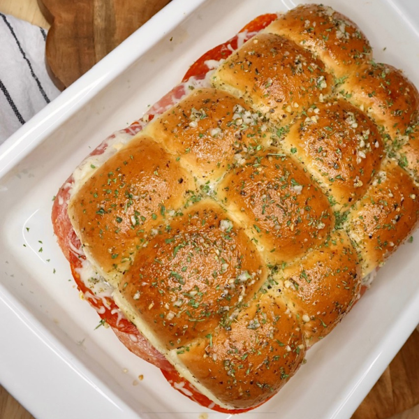 Overhead image of Italian Sliders in a white baking dish