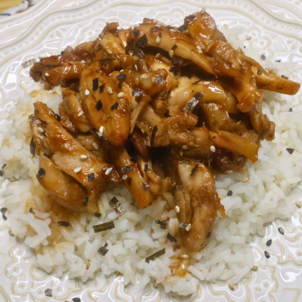 Copycat Mall Bourbon Chicken on a bed of rice