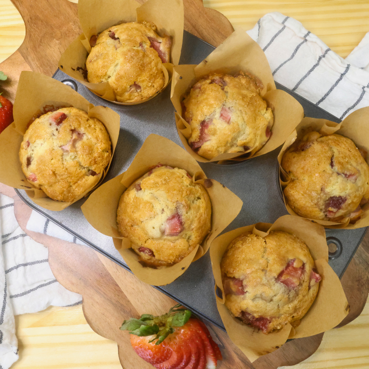 Overhead image of Strawberry Muffins with sour cream in a muffin tin