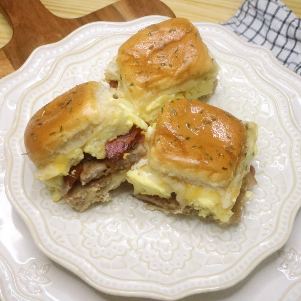 Three Breakfast Hawaiian Roll Sliders on a decorative plate