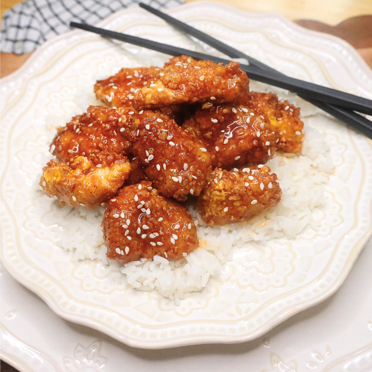 Air Fryer Korean Popcorn Chicken on a bed of rice