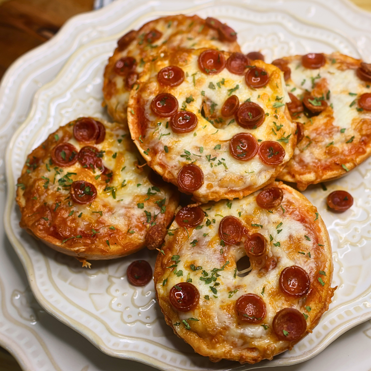 Close up image of air fryer bagel bites on a decorative plate