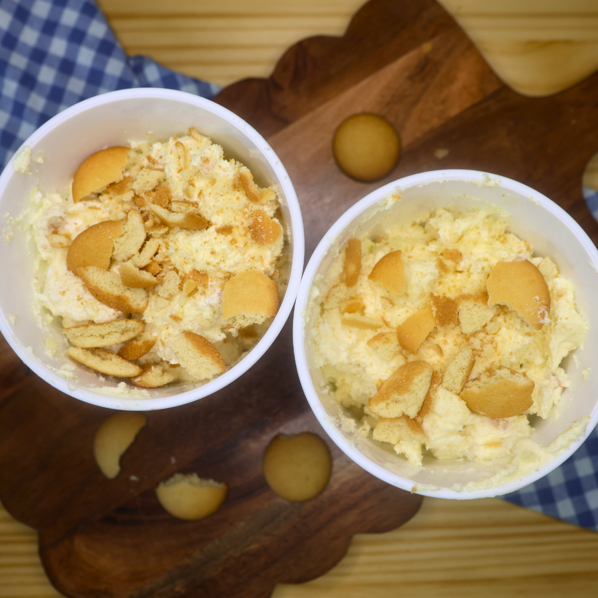 Two containers of no churn banana pudding ice cream with vanilla wafers on top