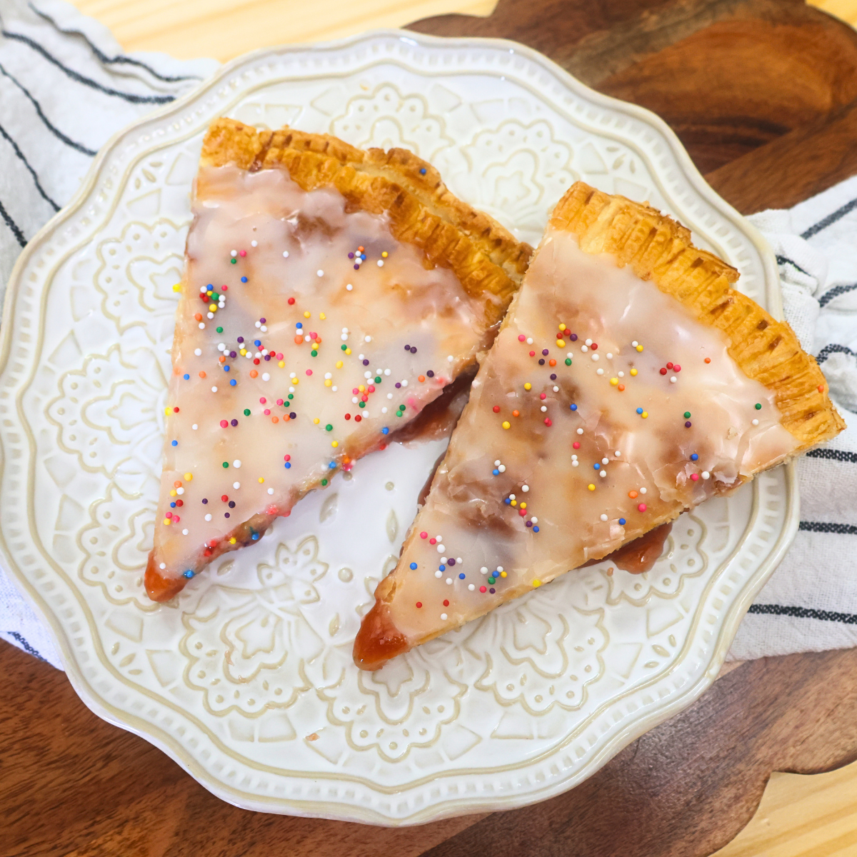 Two slices of a Giant Strawberry Poptart on a plate